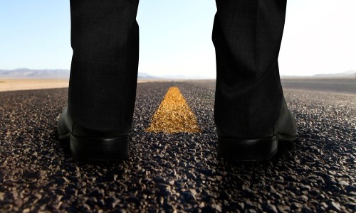 Man standing on the road thinking about a career change