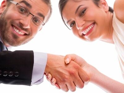Happy people shaking hands after interviewing for a job