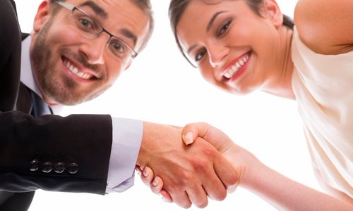 Happy people shaking hands after interviewing for a job