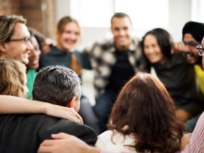 Diverse team huddled together in the workplace