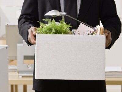 Fired Employee Leaving with Box of Personal Belongings