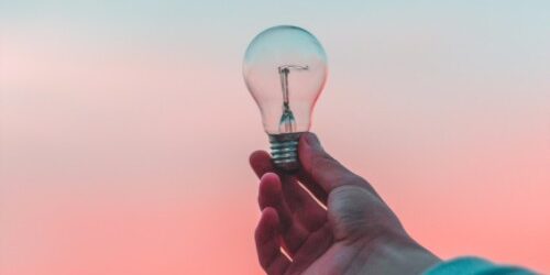 Entrepreneur with an Idea Aolding a Light Bulb