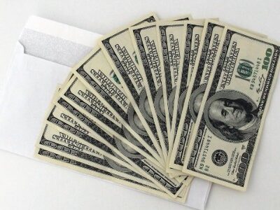 Money in an envelope used to pay salaries or bonuses