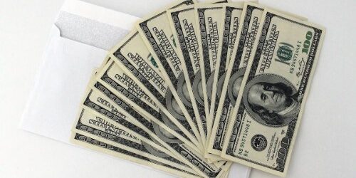 Money in an envelope used to pay salaries or bonuses